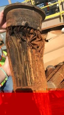 Image of a crushed baghouse filter bag
